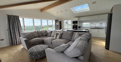 Large C-shape sofa in open plan living area