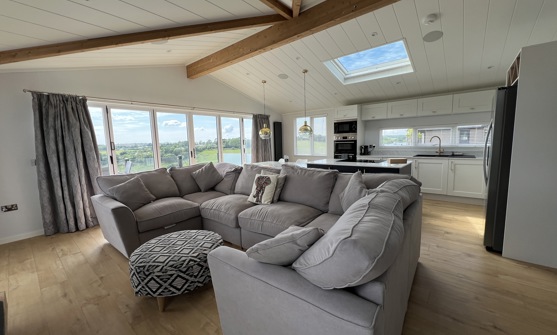 Large C-shape sofa in open plan living area