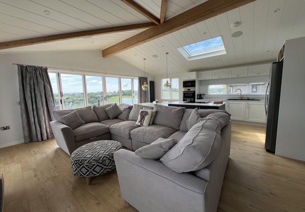 Large C-shape sofa in open plan living area