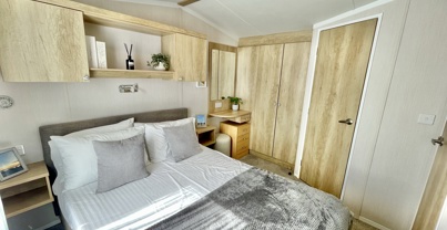 Internal of a caravan master bedroom with ensuite and dressing area