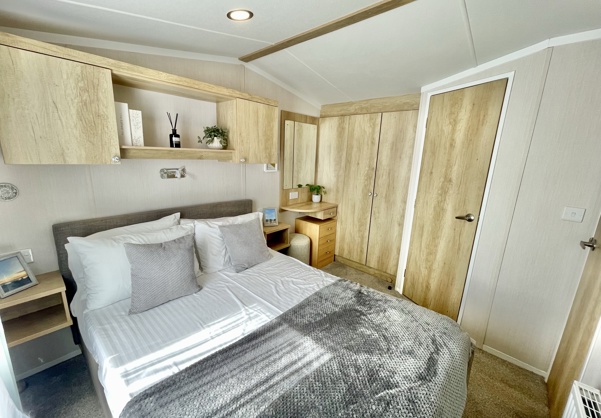 Internal of a caravan master bedroom with ensuite and dressing area