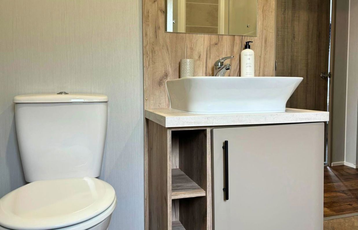 Internal of a lodge bathroom with toilet and sink