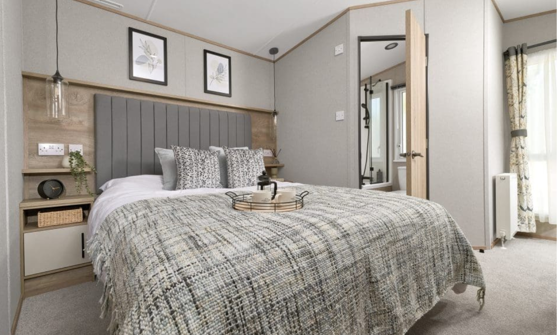 Internal of a caravan master bedroom with ensuite