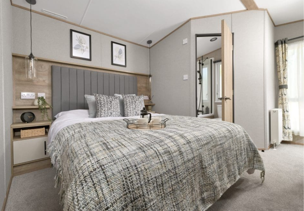 Internal of a caravan master bedroom with ensuite