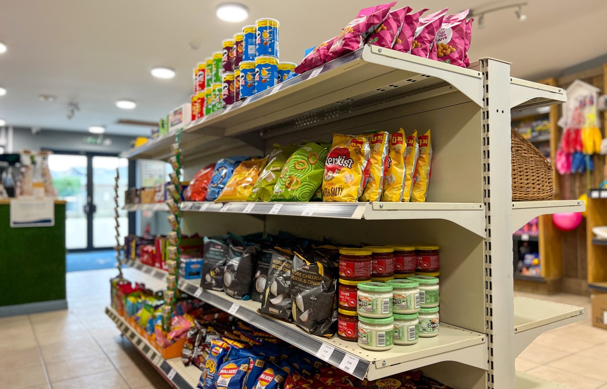 A selection of dry goods on shelves in a small shop on park 
