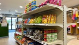 A selection of dry goods on shelves in a small shop on park 