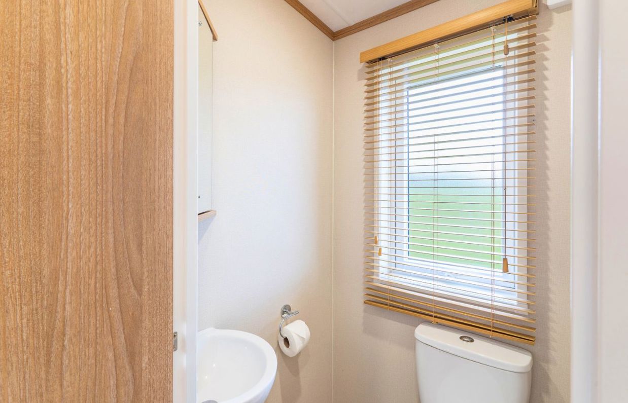 Internal of a caravan bathroom with sink and toilet