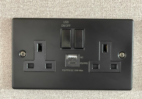 Plug socket in a caravan with USB and USB-C sockets
