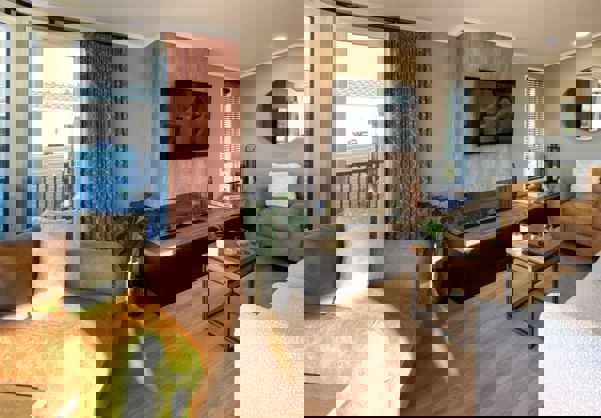 Lounge with large modern fireplace and cosy sofa and armchairs