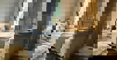 Twin bedroom with small vanity area and walk-in wardrobe