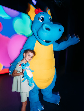 A Young Girl with Vic the Dinosaur