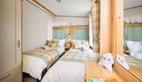 Internal of a caravan twin bedroom