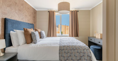 Internal of a luxury lodge master bedroom with dressing area