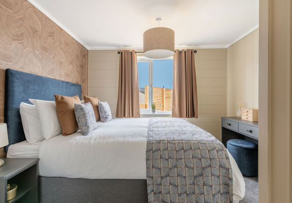 Internal of a luxury lodge master bedroom with dressing area