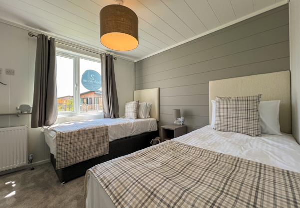 Internal of a luxury lodge twin bedroom