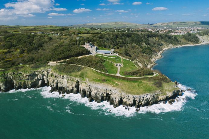 A country park on the cliff edge with views of deep blue sea