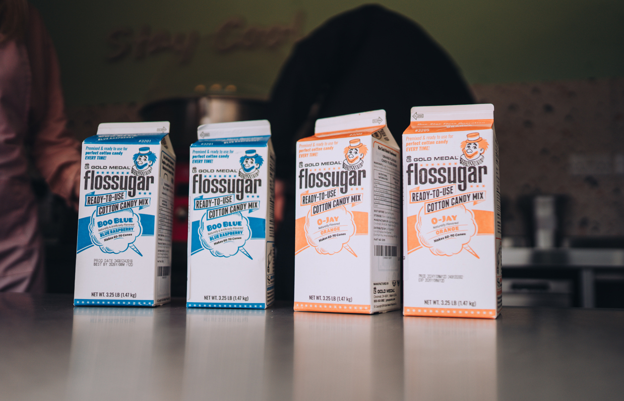 Four cartons of candy floss sugar in retro style packaging