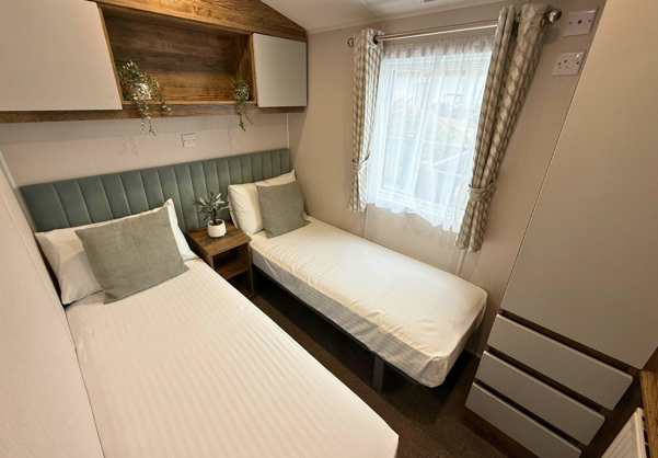 Internal of a caravan twin bedroom