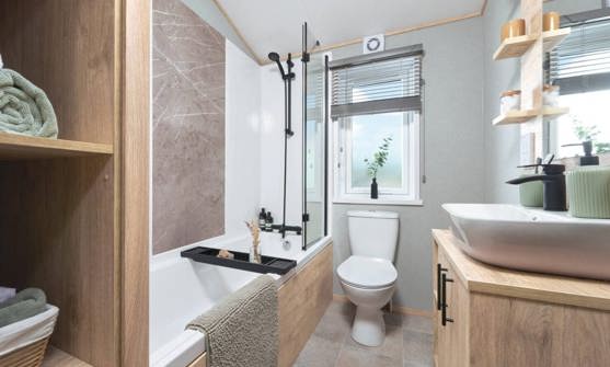 Internal of a lodge bathroom with shower over bath