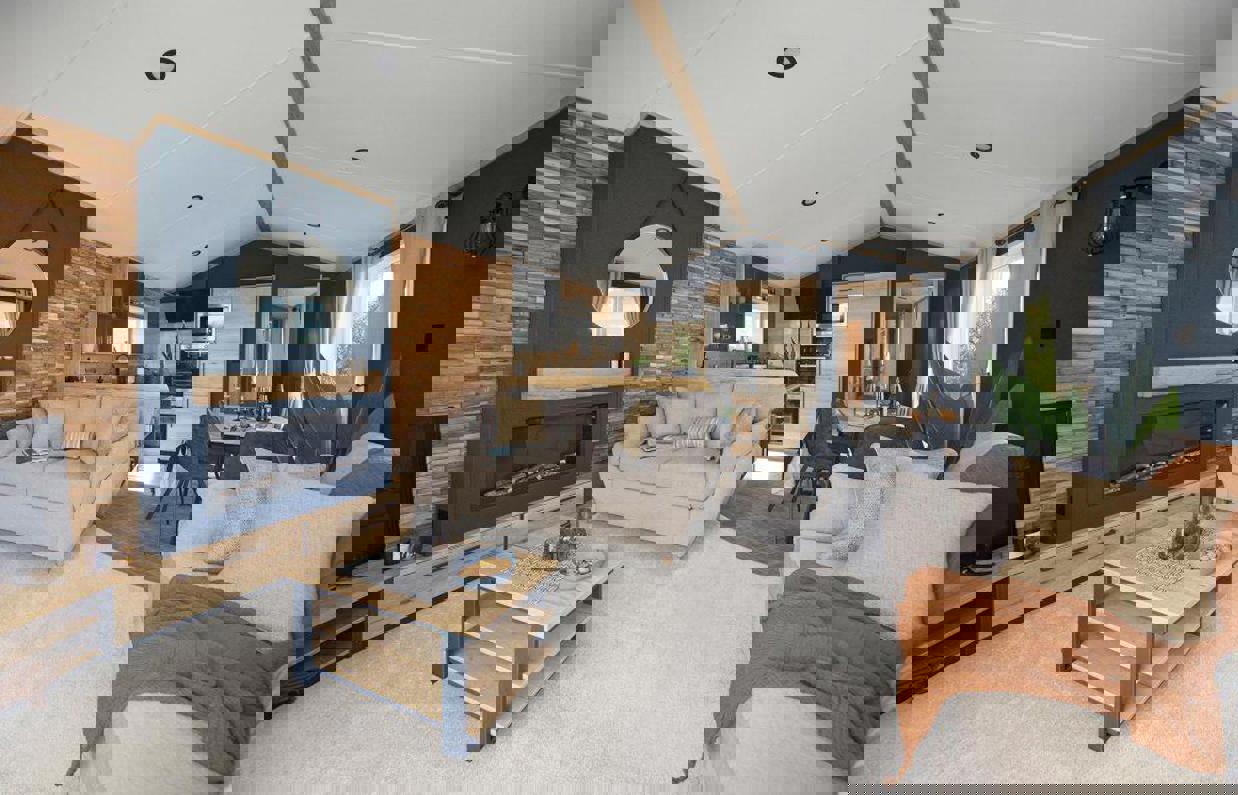 Modern lounge with comfy sofas, fireplace, natural wood, faux brick walls and dark blue walls design