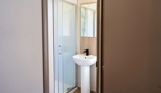 Internal of a caravan bathroom with shower and sink