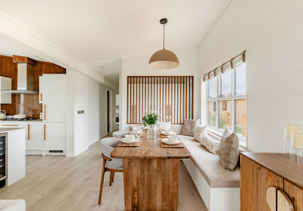 Internal of a luxury lodge open plan dining area with bench seating