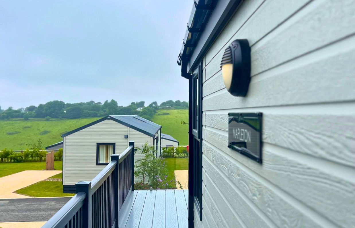 External of a lodge on pitch with countryside views
