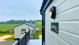 External of a lodge on pitch with countryside views