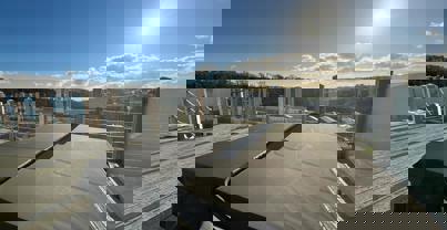 Hot tub on decking with valley and woodland views