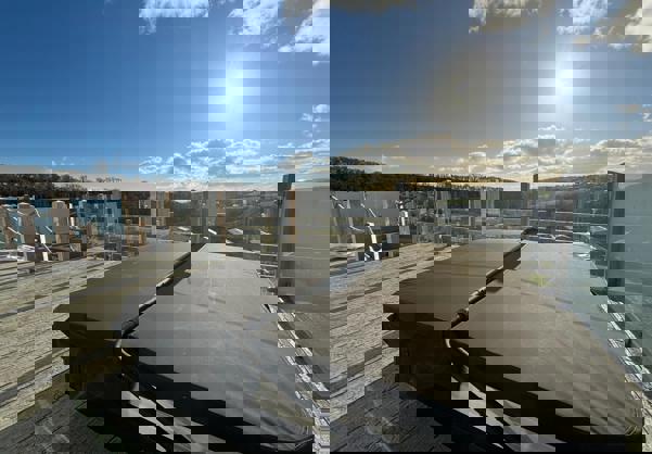 Hot tub on decking with valley and woodland views