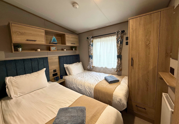 Internal of a caravan twin bedroom