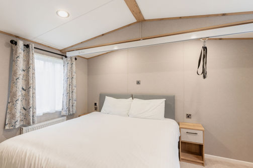 Internal of an accessible caravan double bedroom with hoist