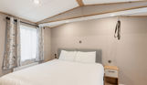 Internal of an accessible caravan double bedroom with hoist