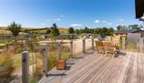 External of a cabin with decking and outdoor furniture