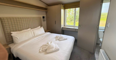 Internal of a caravan master bedroom with ensuite