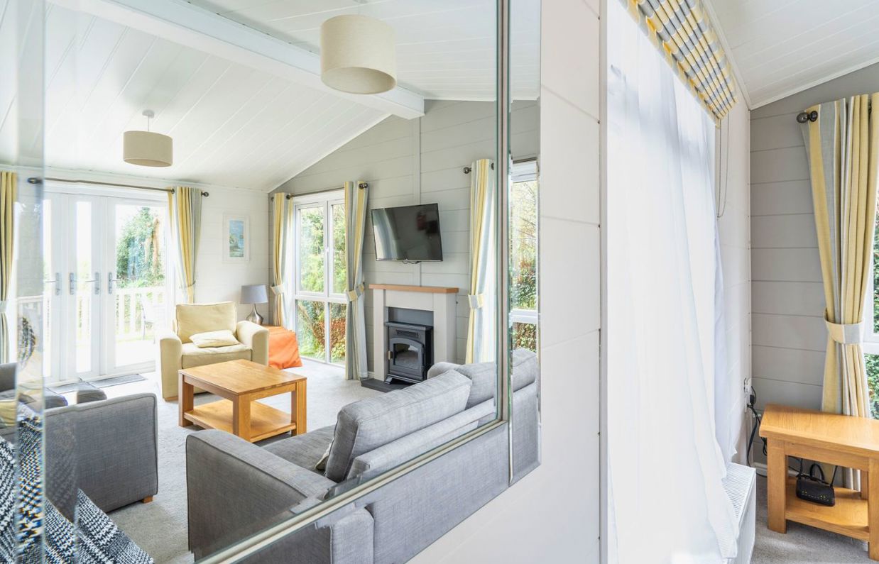 Internal of a lodge open plan living space reflected in a mirror
