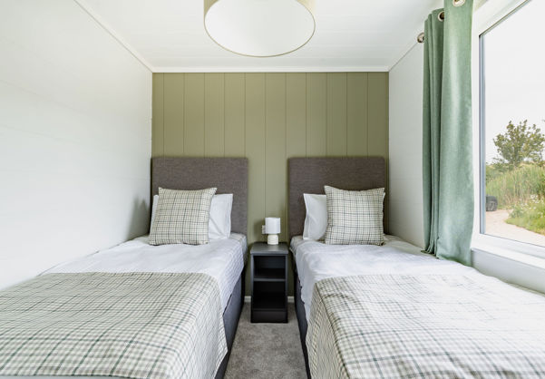 Internal of a luxury lodge twin bedroom