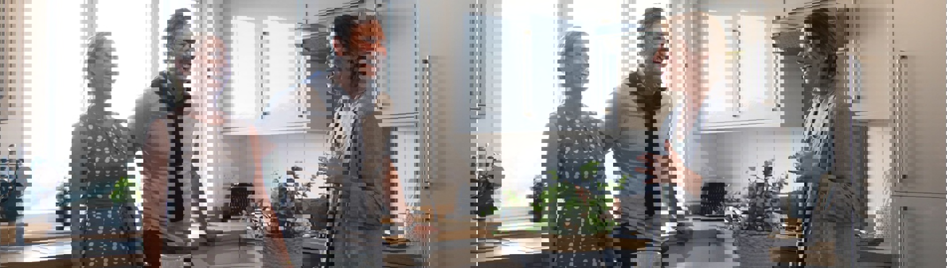 A couple being shown around a holiday home by a sales team member