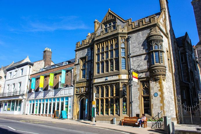 The outside of a grand building housing Dorset Museum & Art Gallery