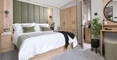 Internal of a caravan master bedroom with ensuite