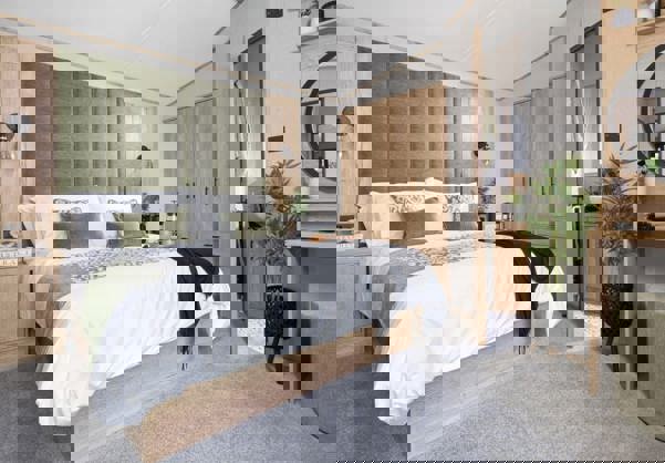 Internal of a caravan master bedroom with ensuite