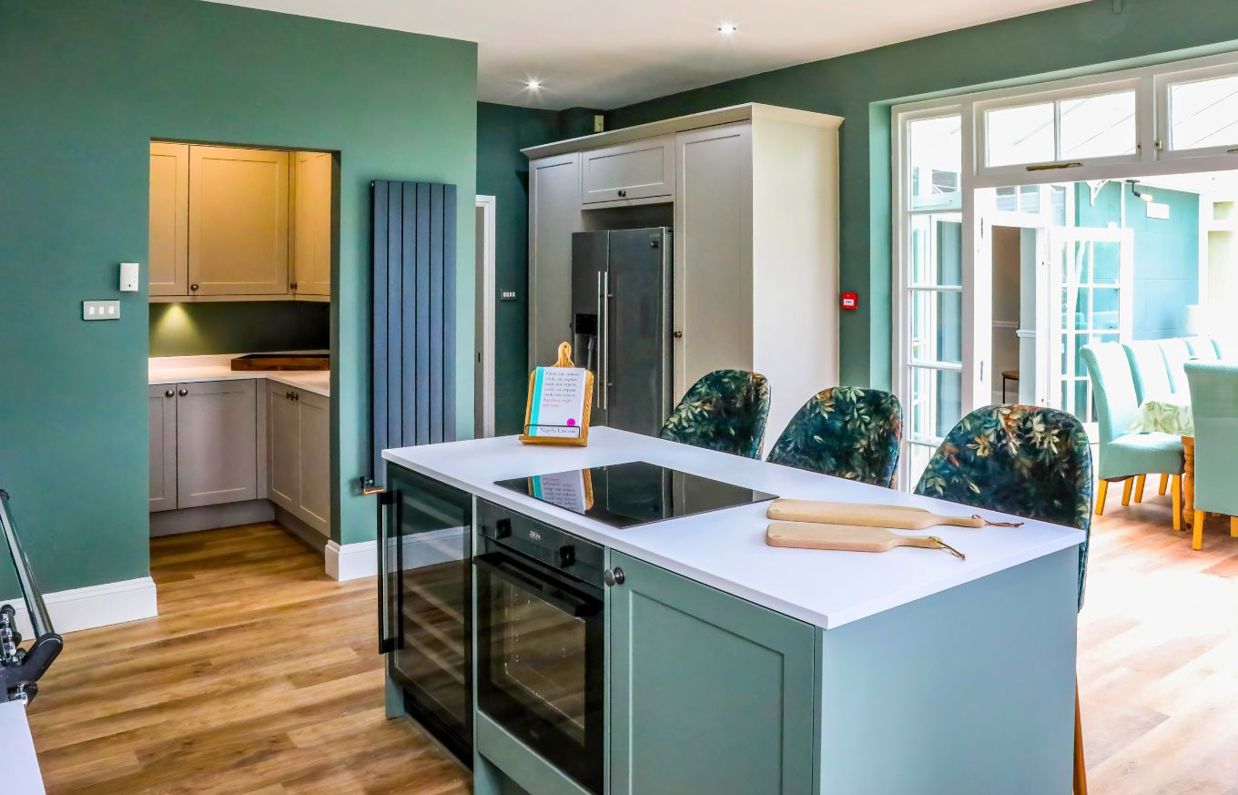 Internal of a manor house open plan kitchen with pantry and conservatory