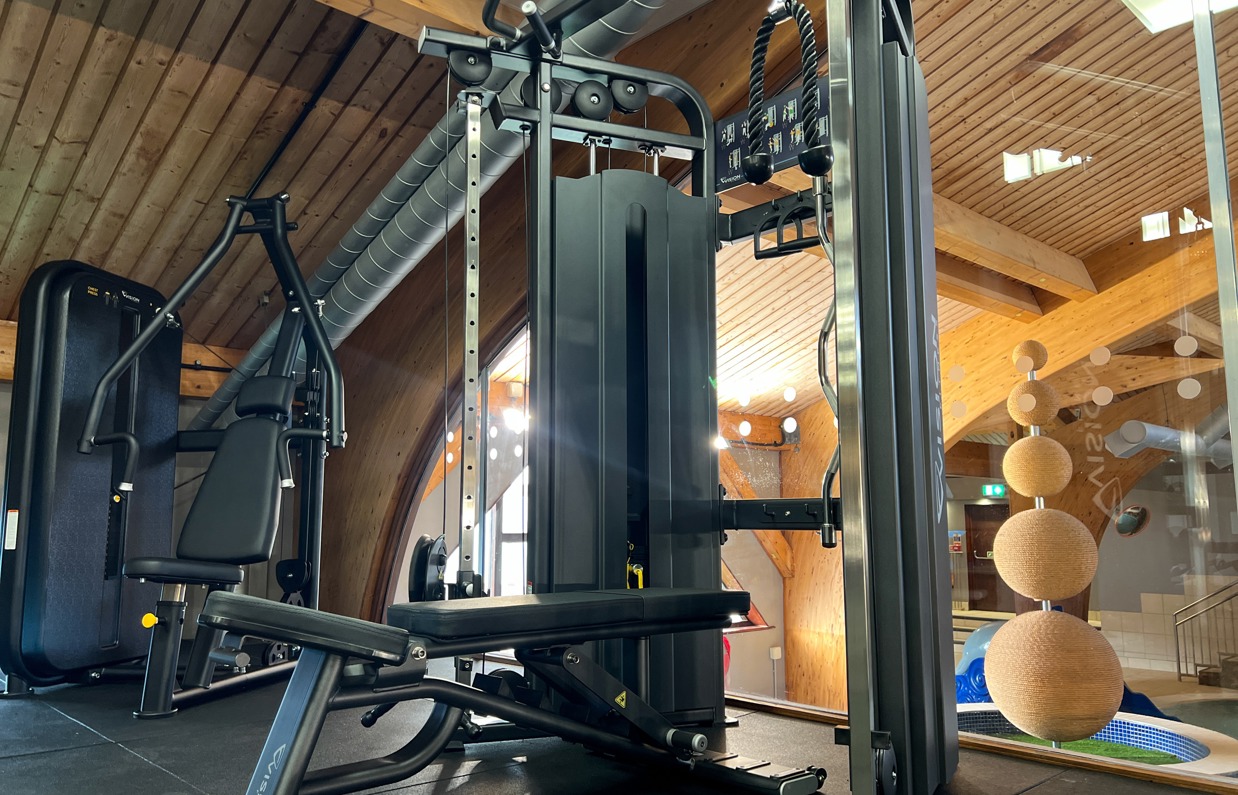 Inside of a modern gym facility with various equipment