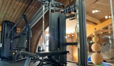 Inside of a modern gym facility with various equipment