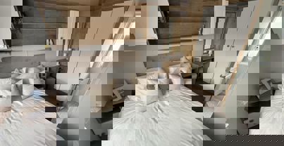 Internal of a caravan master bedroom with ensuite