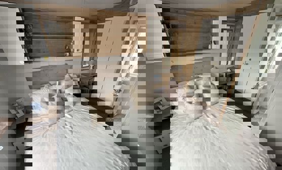 Internal of a caravan master bedroom with ensuite