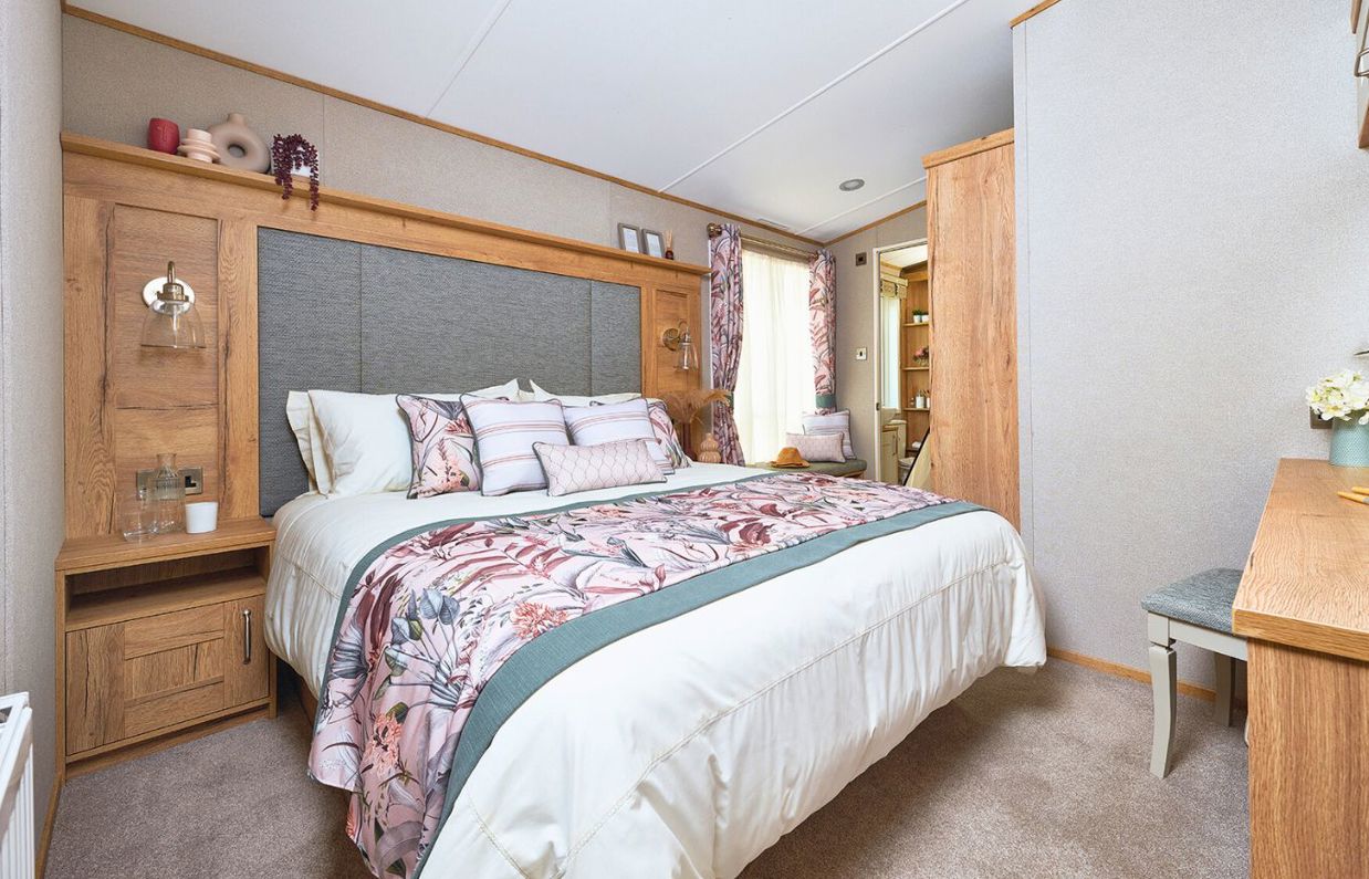 Internal of a caravan master bedroom with dressing area and ensuite