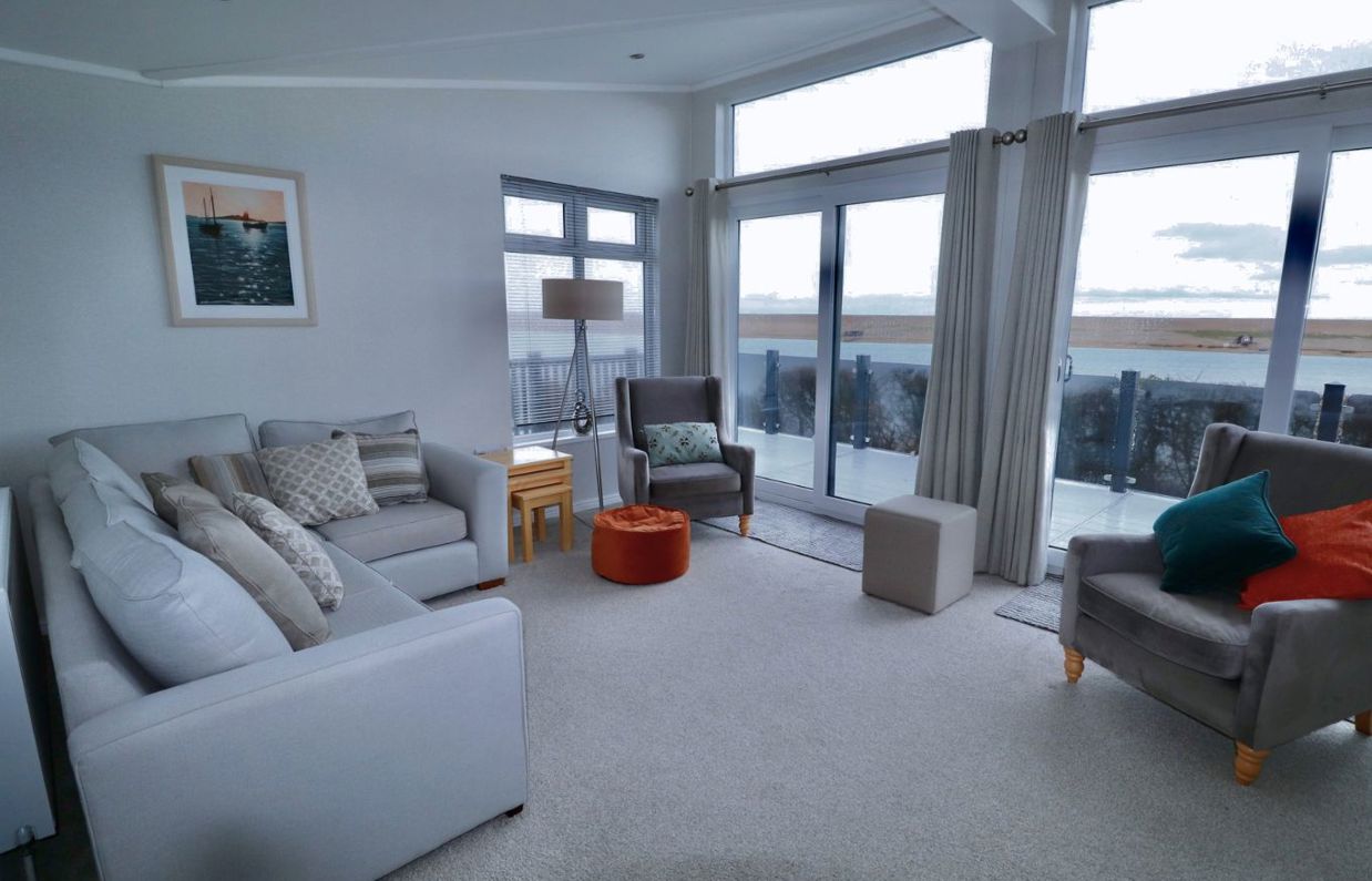 Internal of a caravan open plan lounge with seaviews