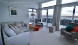 Internal of a caravan open plan lounge with seaviews