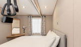 Internal of an accessible caravan double bedroom with hoist